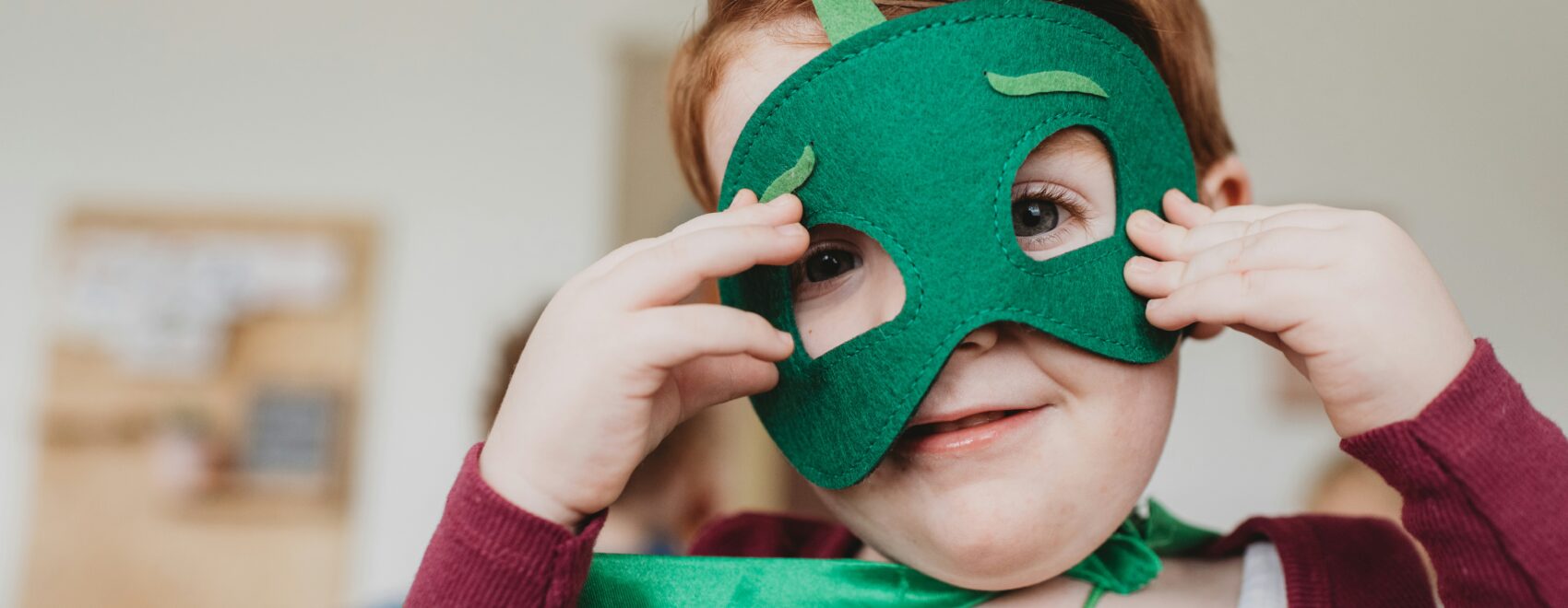 child in hero mask